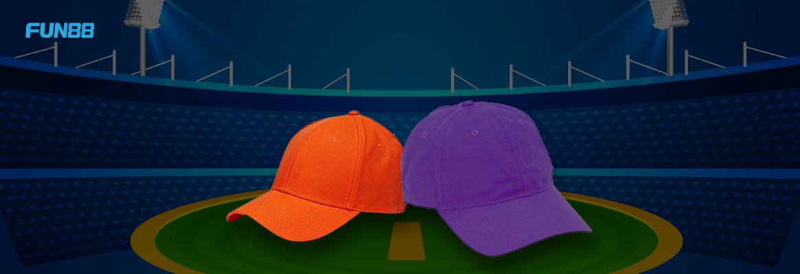 IPL’s orange and purple cap on a green surface with blue background